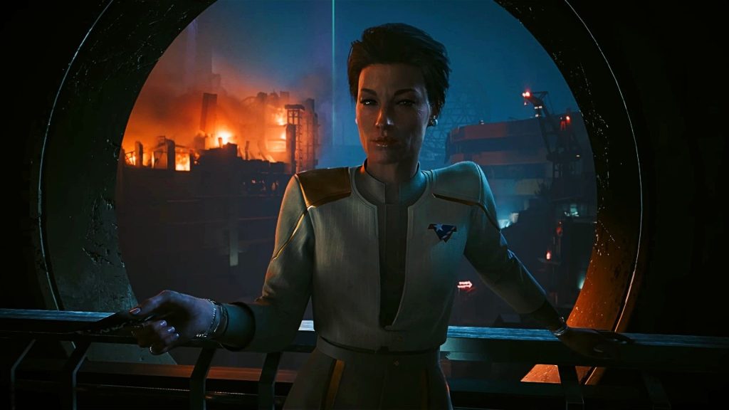 Don't expect Cyberpunk 2 to be third-person or have flashy cutscenes, as lead dev explains "I value our uninterrupted immersion more" A character from Cyberpunk 2077's upcoming Phantom Liberty expansions stands in front of a field of wreckage