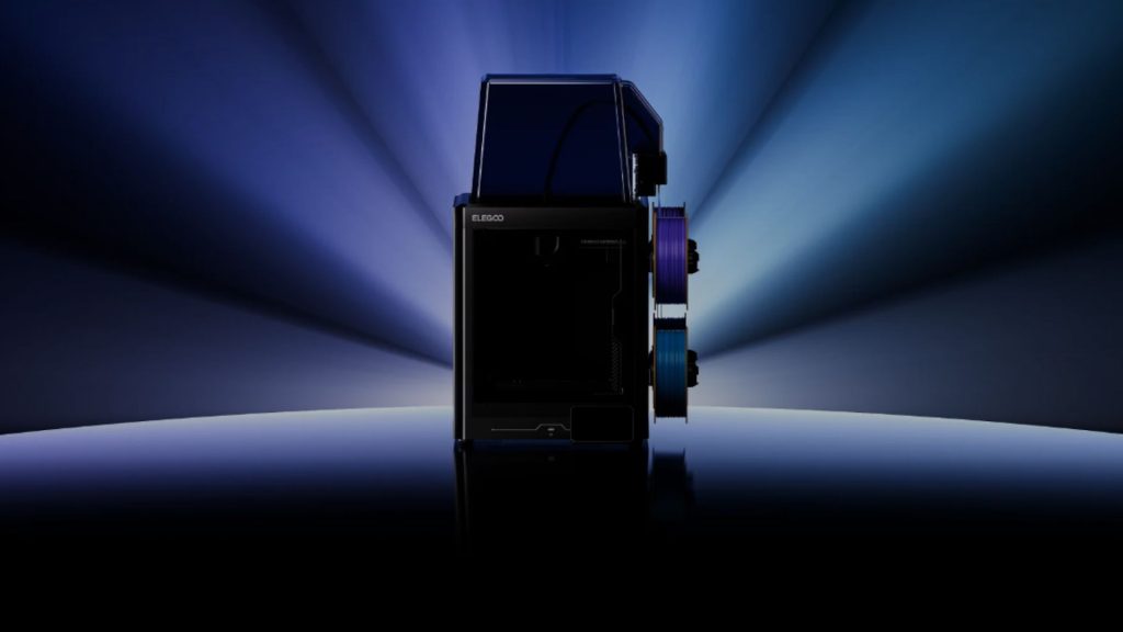 A new version of my favorite 3D printer from last year is on the way Elegoo Centauri Carbon 2 Combo, cast in shadow with blue light rays behind it