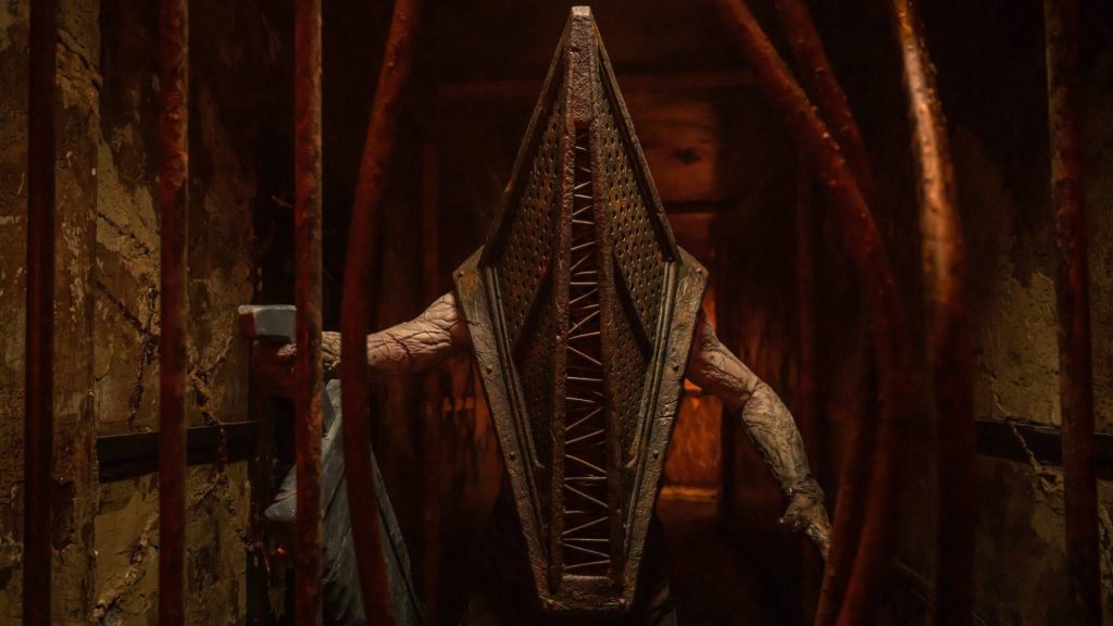 Return to Silent Hill is a disaster, and further proof that Hollywood still hasn't figured out how to adapt horror video games Pyramid head peering through bent bars in Return to Silent Hill