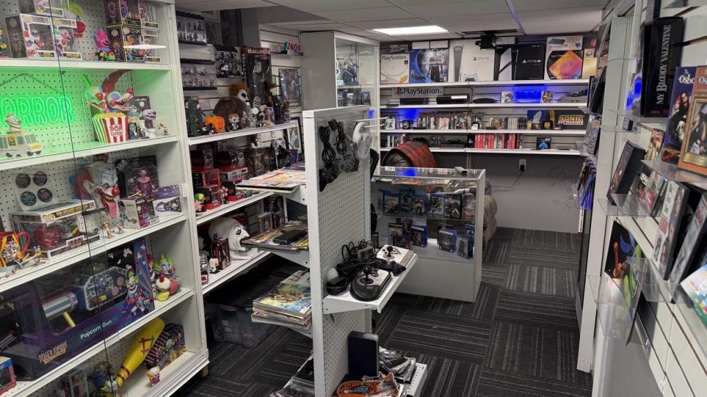 Why and how a JRPG fan spent $2,000 building a GameStop in his basement: "The spaces combined with the passions in our lives have the power to bring people together" Photographs of custom game store collection display with dozens of games and boxes on shelves