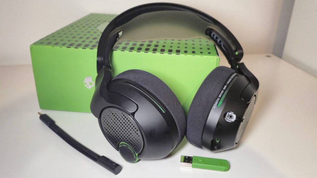 Photo of a black and green headset sitting on a green box.