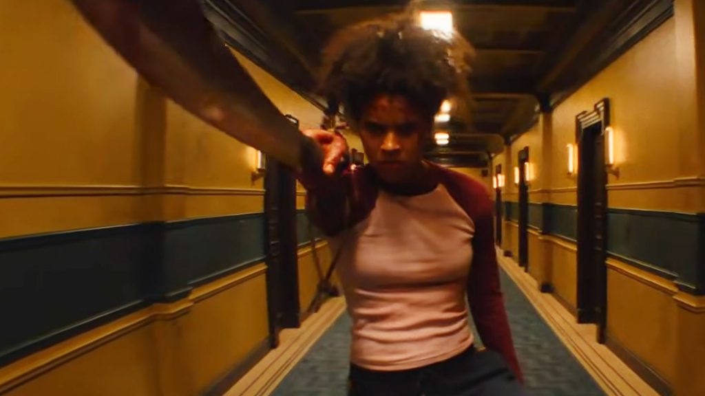 Zazie Beetz's unnamed hero brandishing a blade