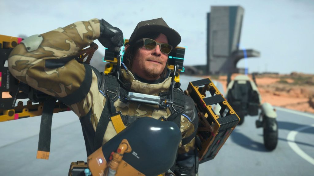 Sam Porter Bridges flexes for the camera in Death Stranding 2