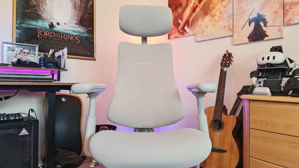 A LiberNovo Omni chair in front of an RGB corner light