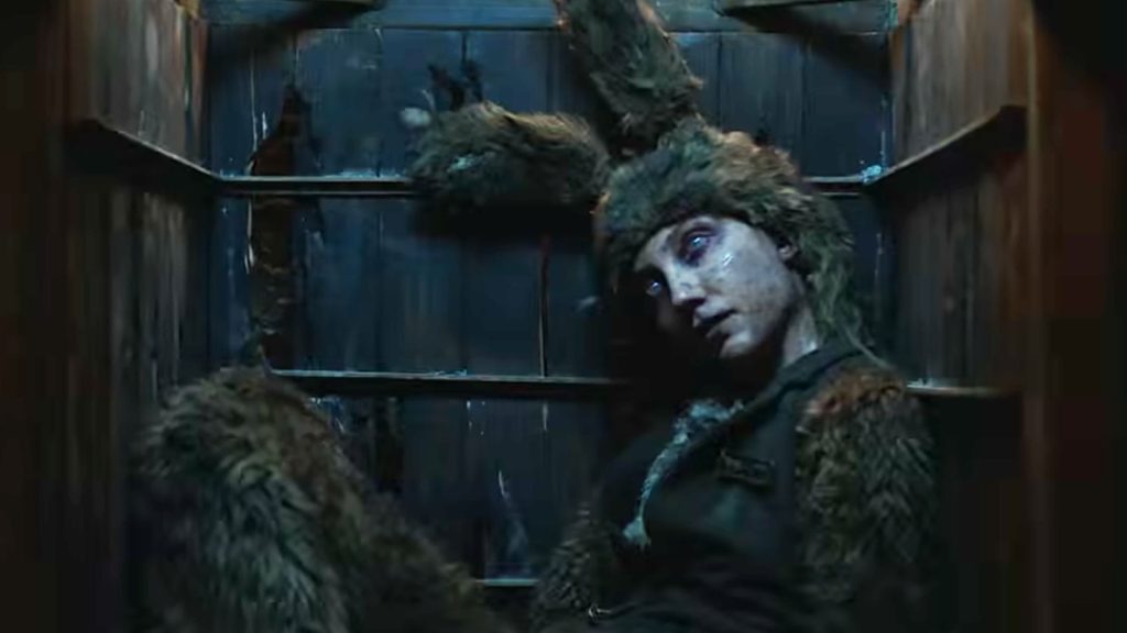 An apparently dead person wearing a matted fur bunny suit