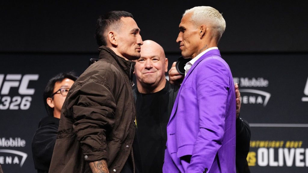Opponents Max Holloway and Charles Oliveira of Brazil face off during the UFC 326 press conference