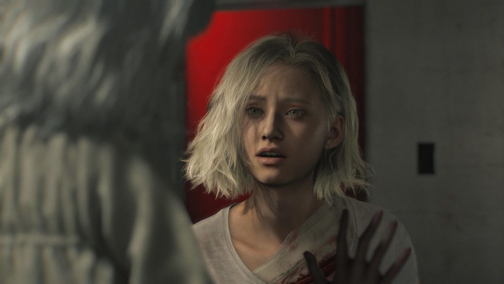 A close-up of Grace talking with someone through glass in Resident Evil Requiem