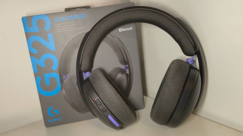 Photo of the black Logitech G325 Lightspeed headset sitting in front of its box.