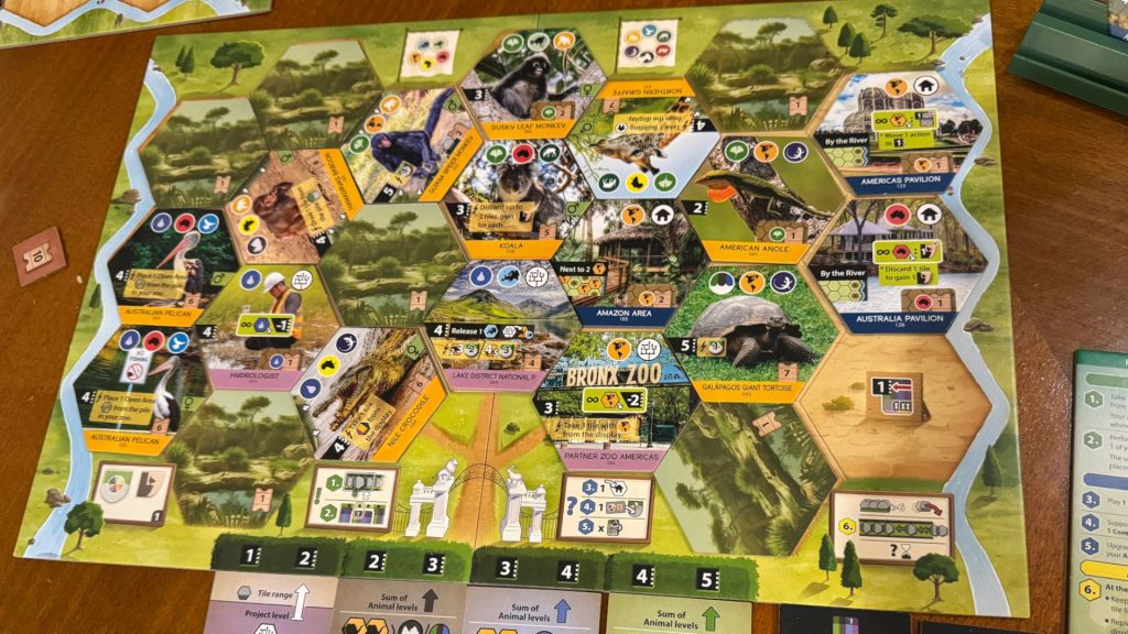 Sanctuary board and tiles on a wooden surface