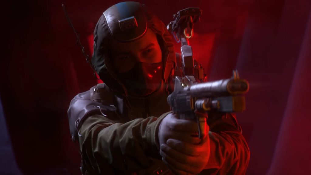 Arc Raiders player holding a gun in red light