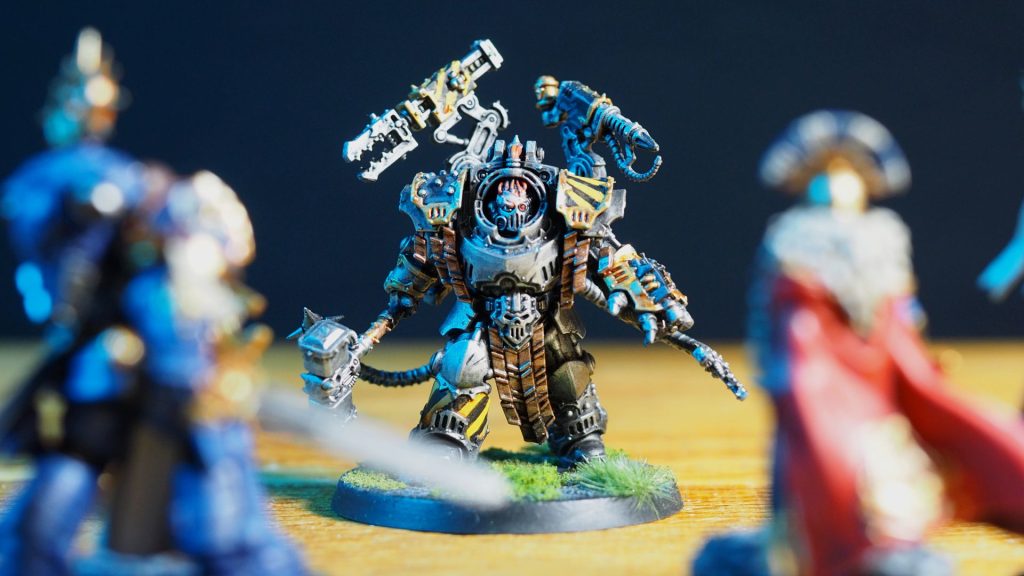 Warhammer 40K Kravek Morne model facing off against other heroes
