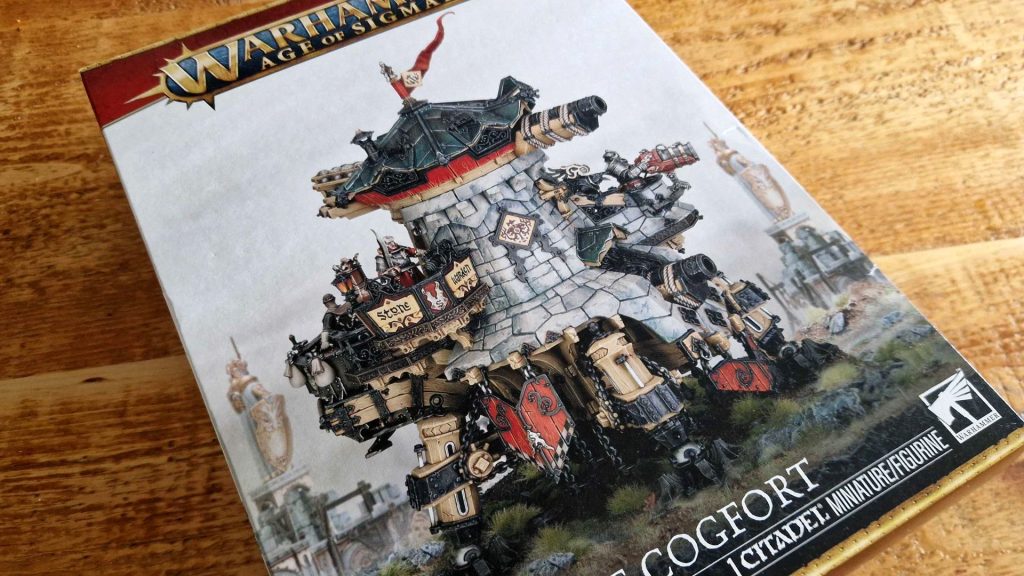 I tried the new Cities of Sigmar models, and anyone missing the weird old Warhammer definitely should as well Cities of Sigmar Cogfort box on a wooden surface