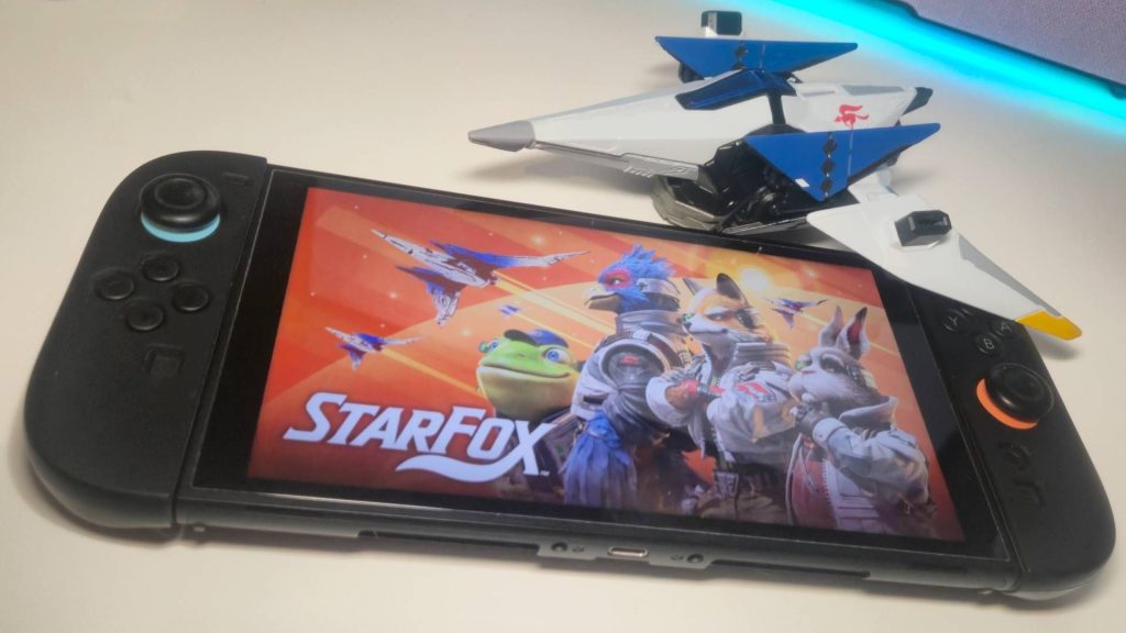 The Switch 2 might be getting more expensive, but games like Star Fox are dropping to record lows even before launch Photo of the key art for Star Fox showing on a Nintendo Switch 2, with a toy Arwing sitting above.