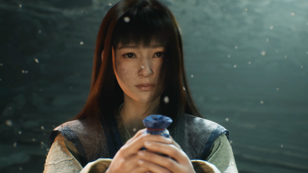 A screenshot shows a young woman holding out a blue pouch