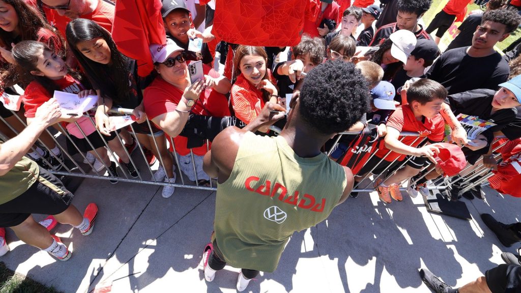 Alphonso Davies #19 of Canada signs autographs afterward as Canada's FIFA 2026 World Cup team trains
