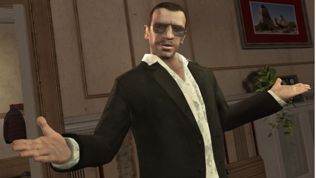 Protagonist Nico Bellic in GTA 4 wearing a suit and shades with his arms outstretched in a kind of "what gives" gesture