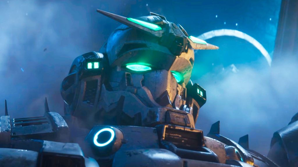 A screencap of the Gundam Rogue Orbit trailer featuring the head of a mech suit with glowing green eyes and a starry sky in the background.